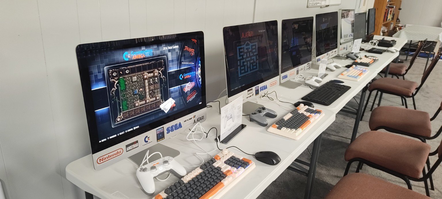 A row of retro gaming stations at the club